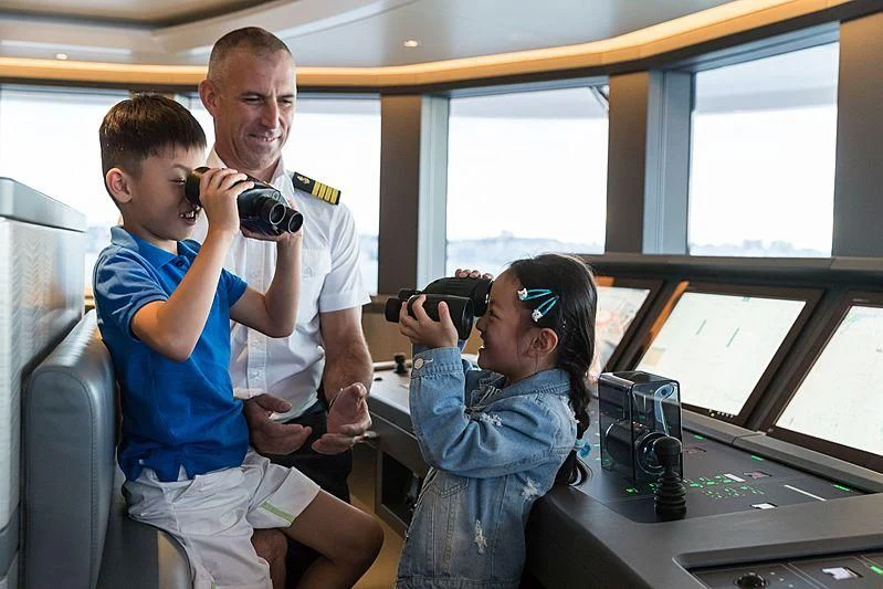 a man taking a picture of a woman and a child aboard VOLPINI 2 Yacht for Sale