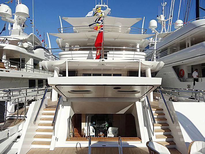 a large white ship with a red stripe on the deck aboard VOLPINI 2 Yacht for Sale