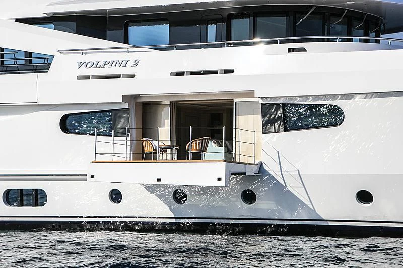 a white yacht with a balcony aboard VOLPINI 2 Yacht for Sale