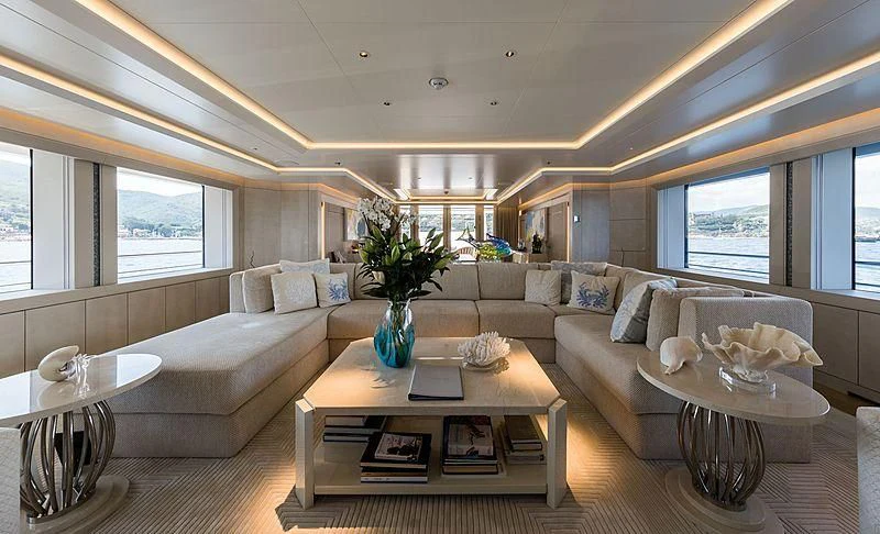a living room with a couch and a table aboard VOLPINI 2 Yacht for Sale