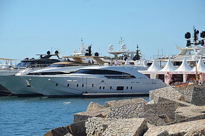a yacht docked at a pier aboard LEA III Yacht for Sale