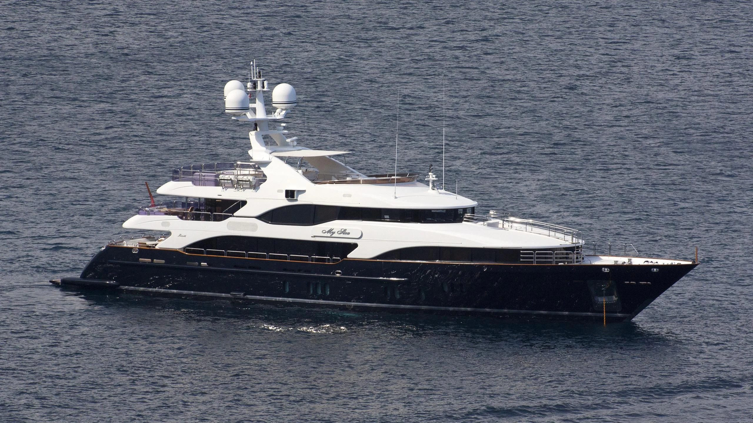 a large ship in the water aboard MY SISA Yacht for Sale