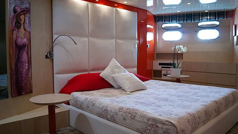 a bed with white sheets aboard SOFIA Y Yacht for Sale