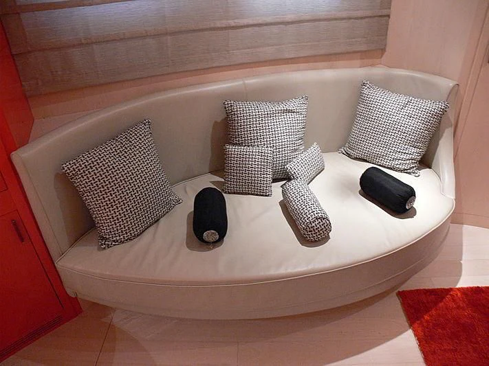 a white bed with a white round table and chairs aboard SOFIA Y Yacht for Sale