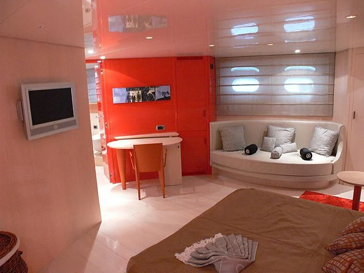 a living room with a couch and a tv aboard SOFIA Y Yacht for Sale