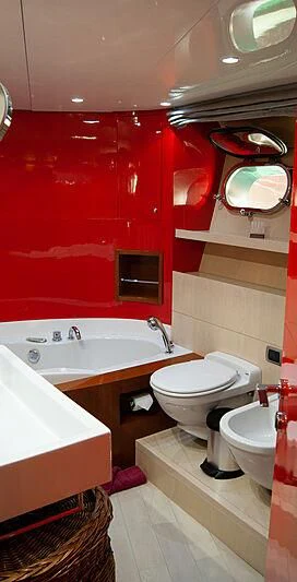 a bathroom with red walls aboard SOFIA Y Yacht for Sale