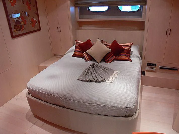 a bed with pillows on it aboard SOFIA Y Yacht for Sale