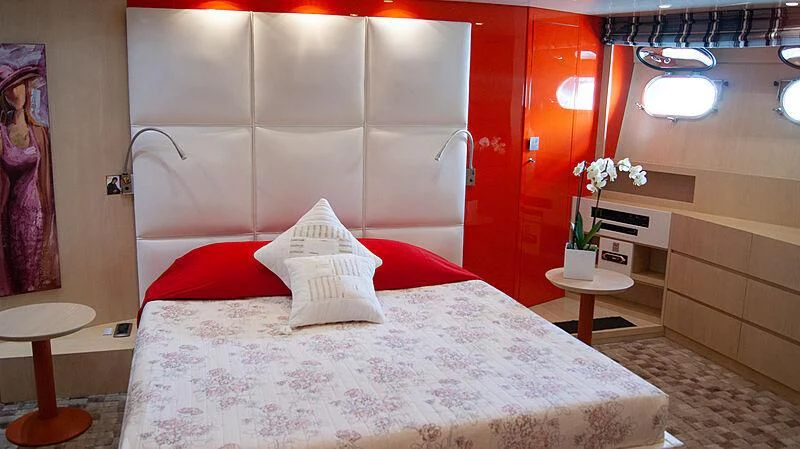 a bed with white sheets and pillows aboard SOFIA Y Yacht for Sale