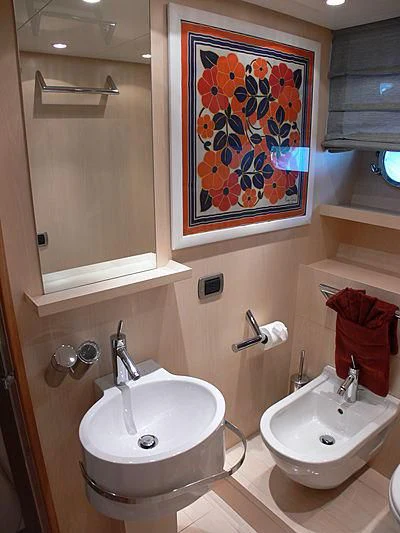 a bathroom with a sink and mirror aboard SOFIA Y Yacht for Sale
