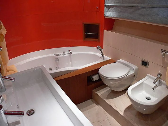 a bathroom with a tub sink and toilet aboard SOFIA Y Yacht for Sale