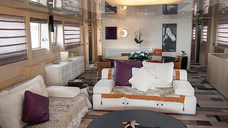 a living room with a couch and a table aboard SOFIA Y Yacht for Sale
