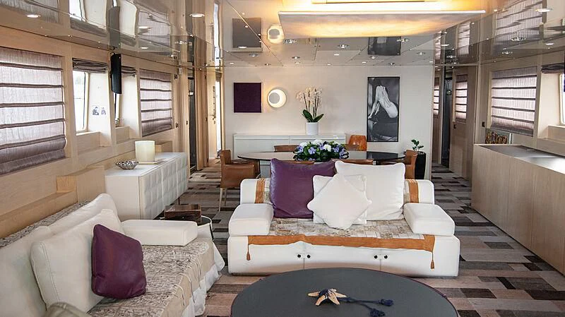 a living room with a couch and a table aboard SOFIA Y Yacht for Sale