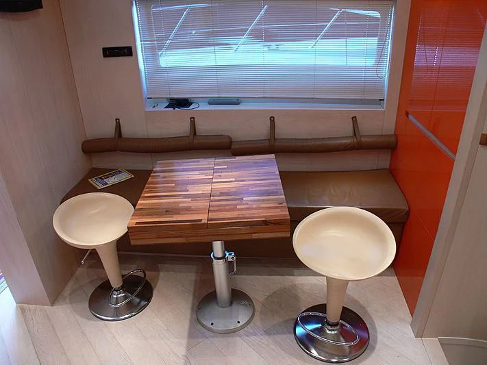 a table with two stools aboard SOFIA Y Yacht for Sale