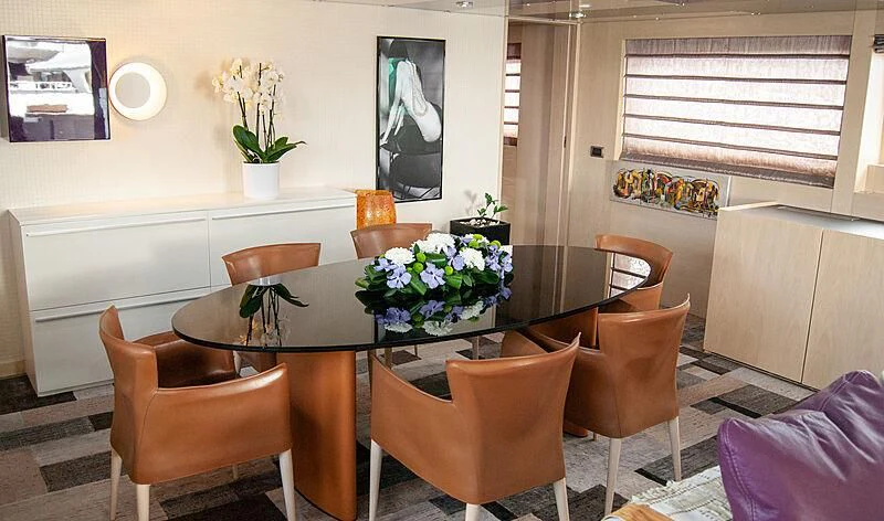 a dining room with chairs and a table aboard SOFIA Y Yacht for Sale