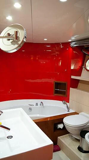 a bathroom with red walls aboard SOFIA Y Yacht for Sale