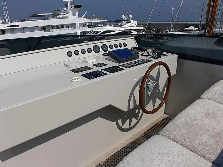 a white yacht with a blue and black design on the front aboard SOFIA Y Yacht for Sale