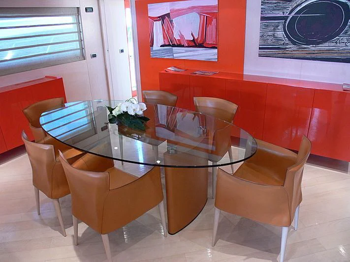 a table with chairs around it aboard SOFIA Y Yacht for Sale