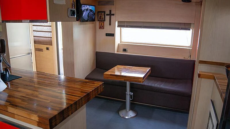 a room with a couch and a table aboard SOFIA Y Yacht for Sale