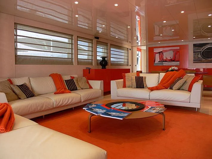 a living room with a couch and a coffee table aboard SOFIA Y Yacht for Sale