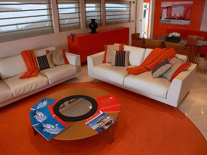 a living room with a couch and a coffee table aboard SOFIA Y Yacht for Sale