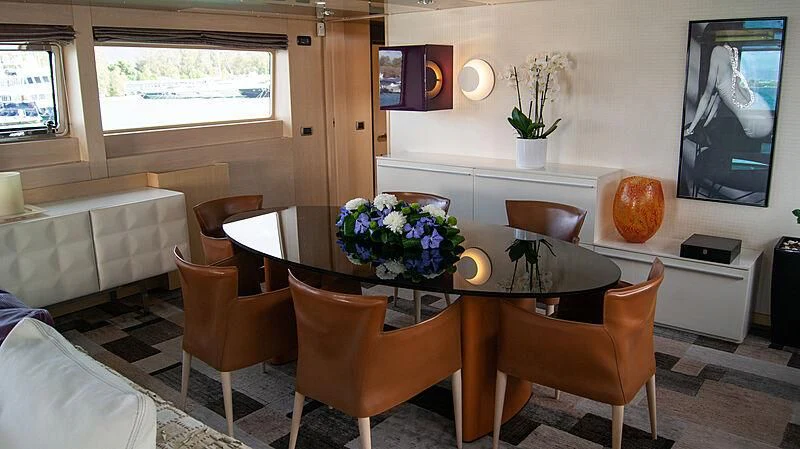 a dining table in a living room aboard SOFIA Y Yacht for Sale