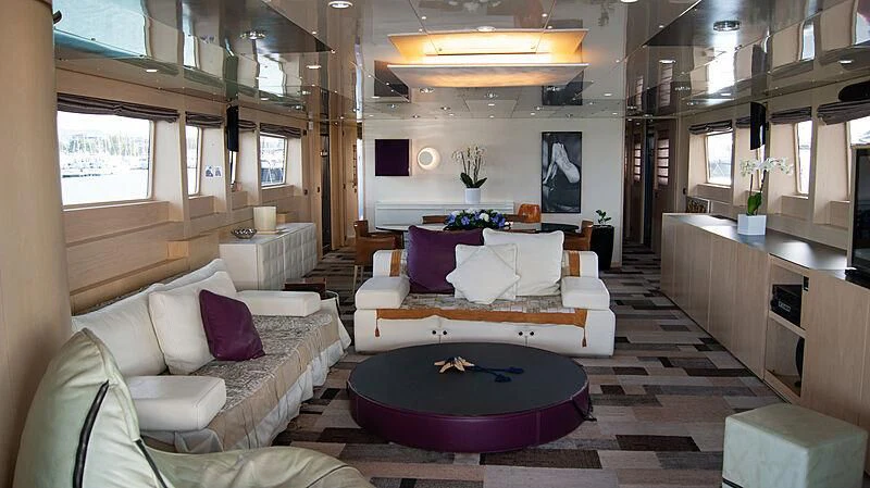 a living room with a purple rug aboard SOFIA Y Yacht for Sale
