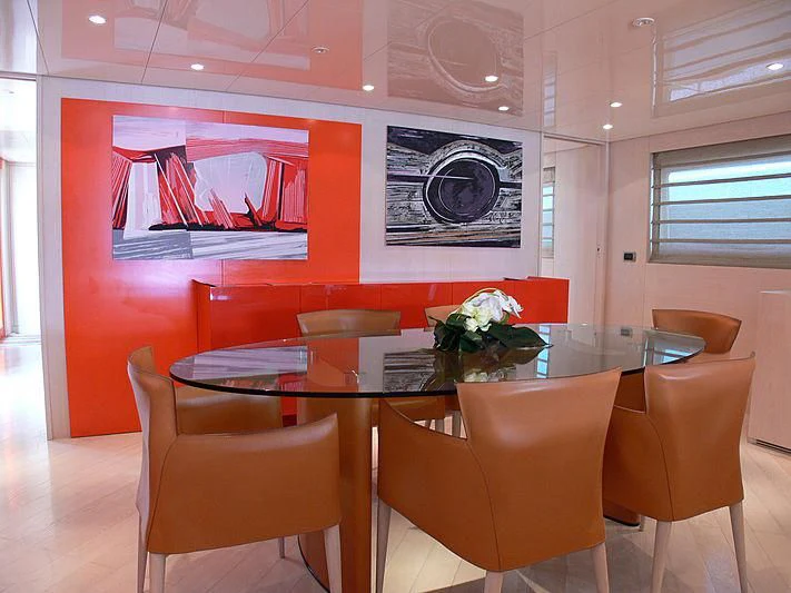 a restaurant with tables and chairs aboard SOFIA Y Yacht for Sale