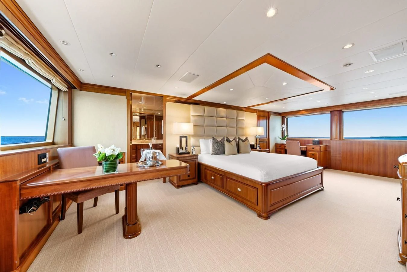 a bedroom with a bed and a table aboard PACKAGE DEAL Yacht for Charter
