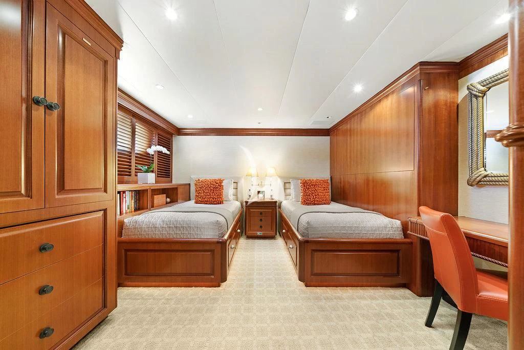 a bedroom with a bed and a couch aboard PACKAGE DEAL Yacht for Charter