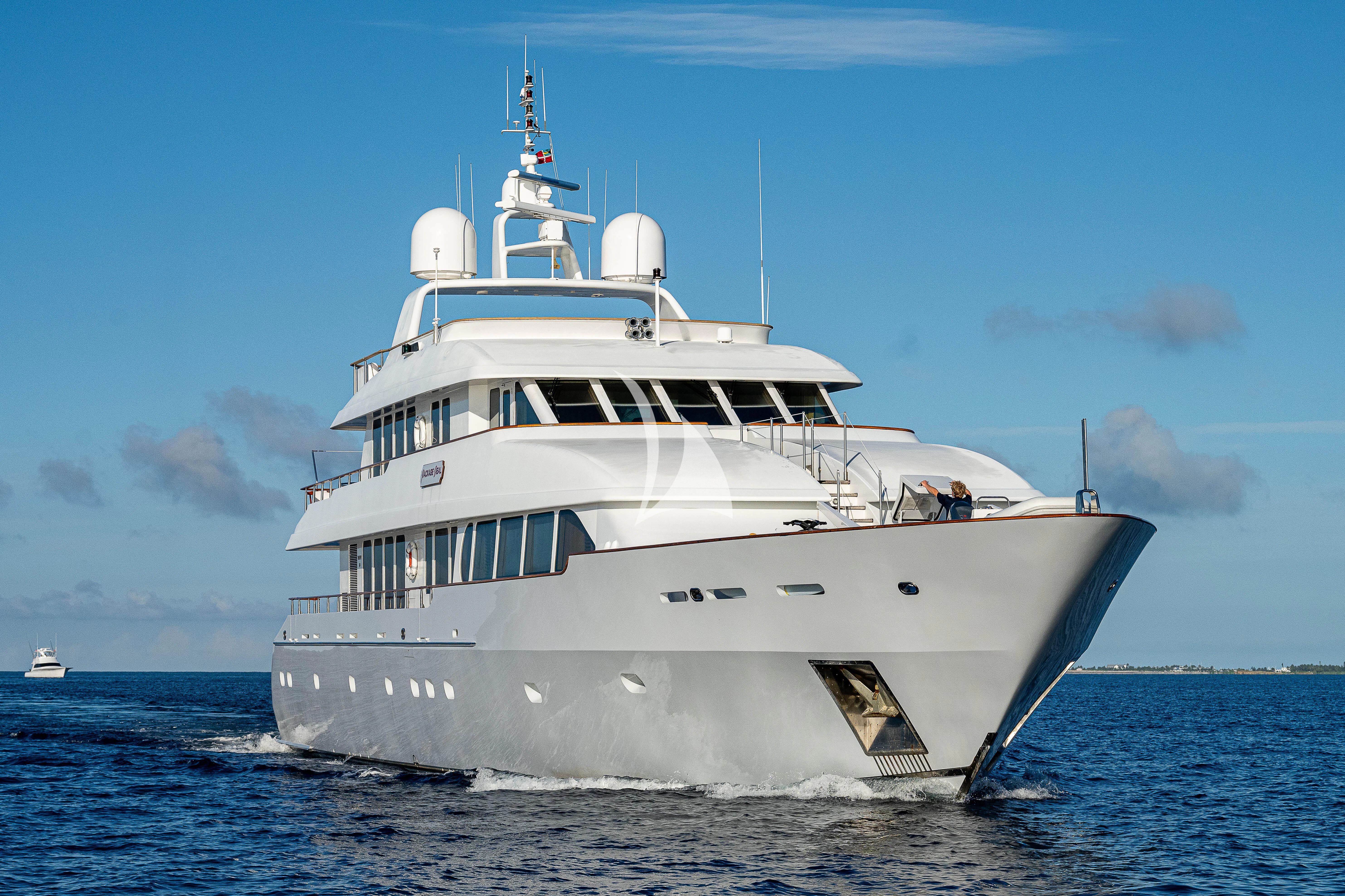 a large white boat in the water aboard PACKAGE DEAL Yacht for Charter