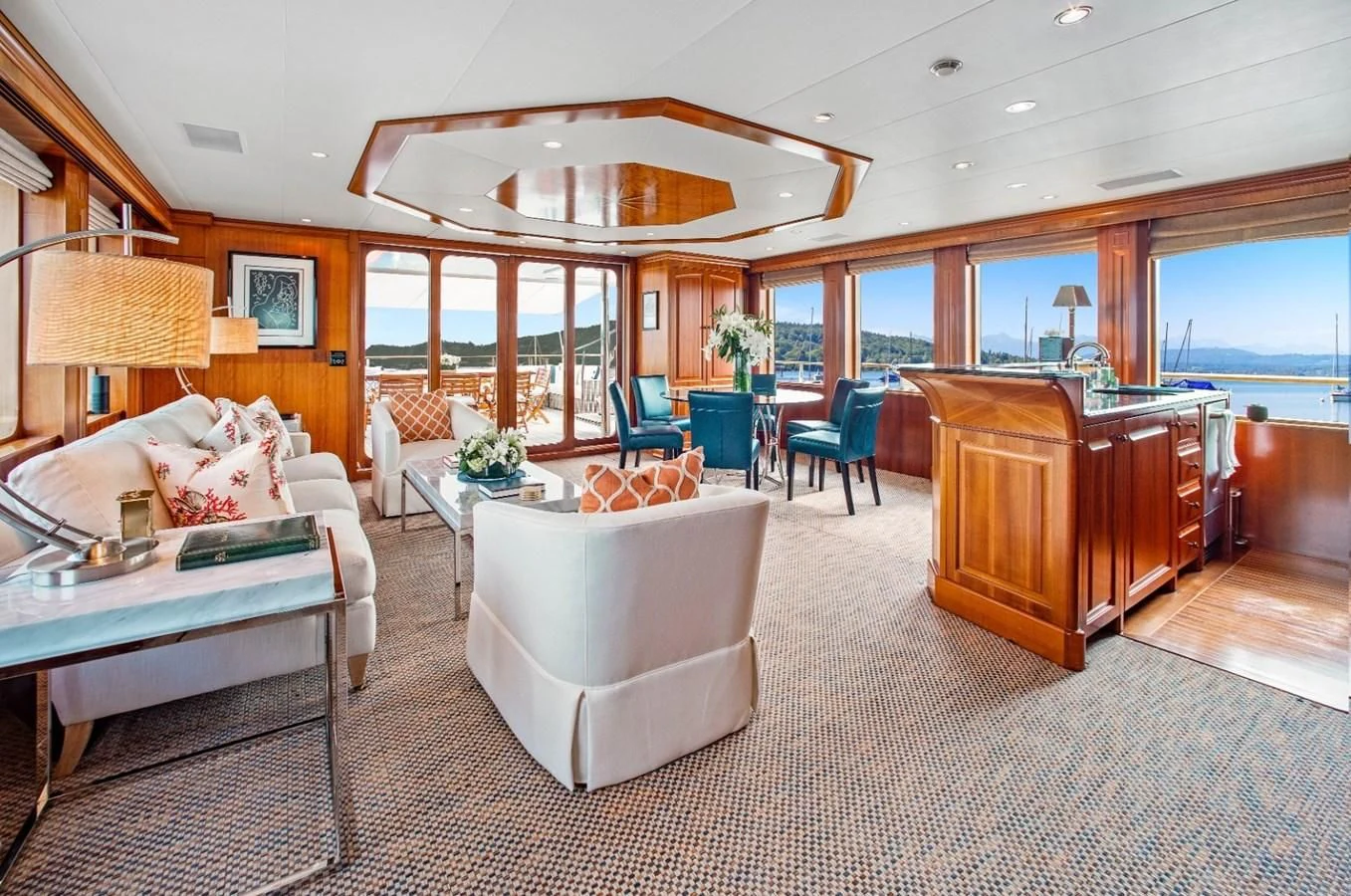 a living room with a large window aboard PACKAGE DEAL Yacht for Charter