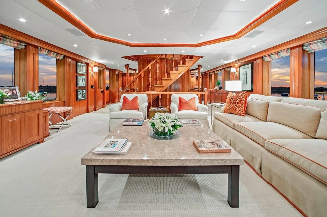 a living room with a table and couches aboard PACKAGE DEAL Yacht for Charter