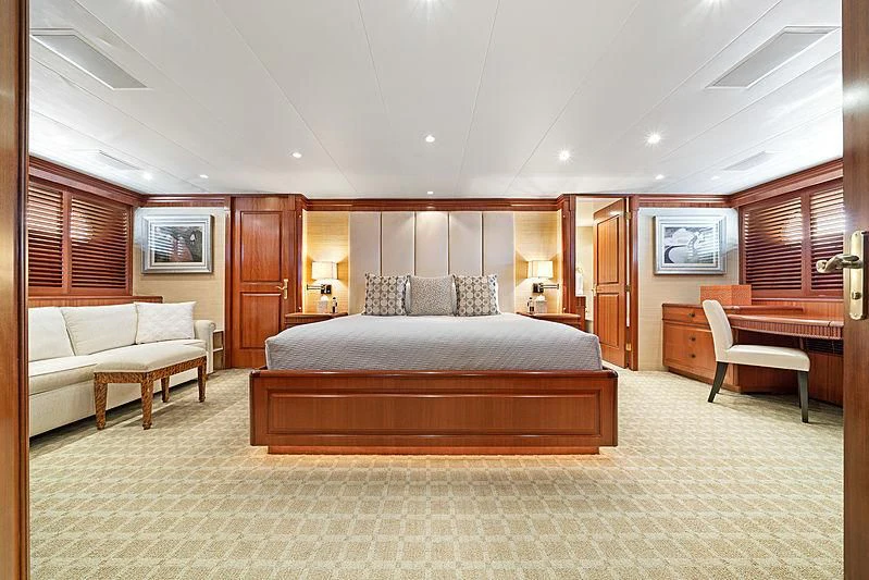 a large bedroom with a bed and a couch aboard PACKAGE DEAL Yacht for Charter