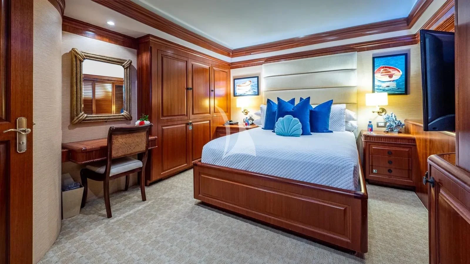 a bedroom with a bed and a desk aboard PACKAGE DEAL Yacht for Charter
