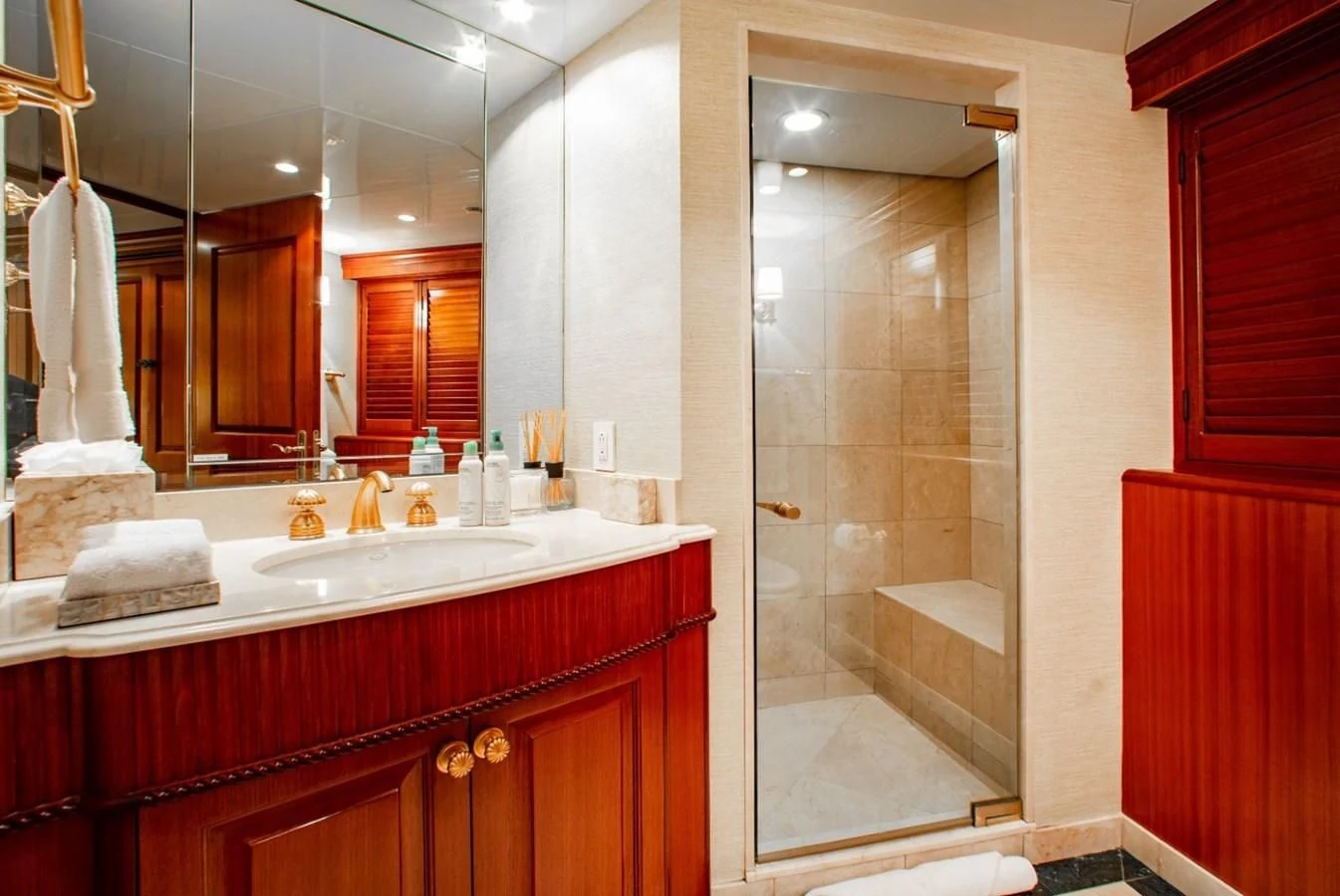 a bathroom with a large mirror aboard PACKAGE DEAL Yacht for Charter