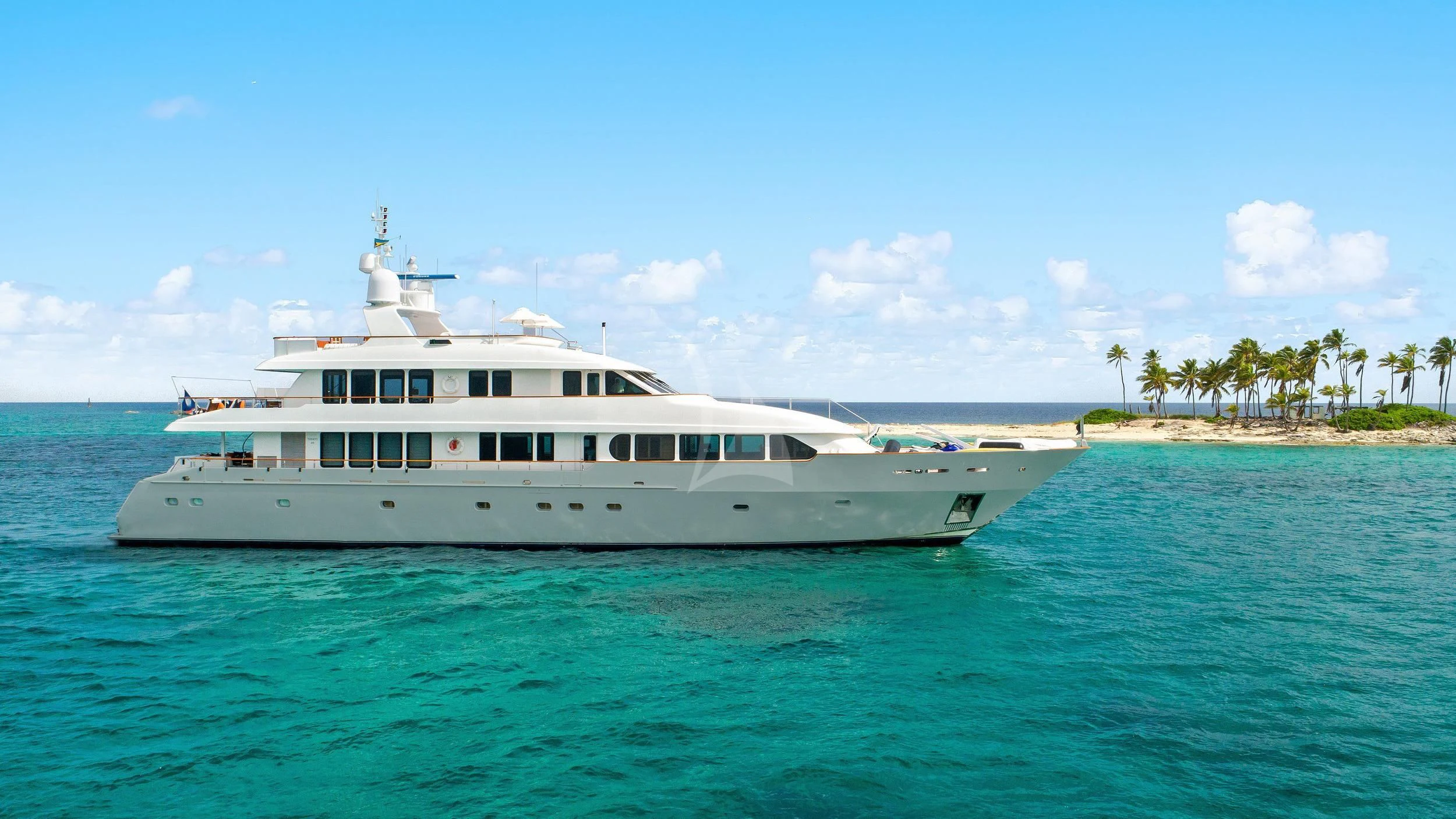 a large white boat in the water aboard PACKAGE DEAL Yacht for Charter