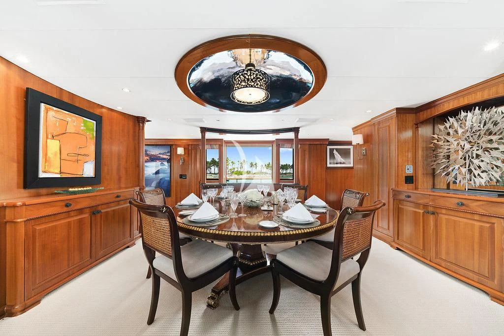 a dining room with a table and chairs aboard PACKAGE DEAL Yacht for Charter