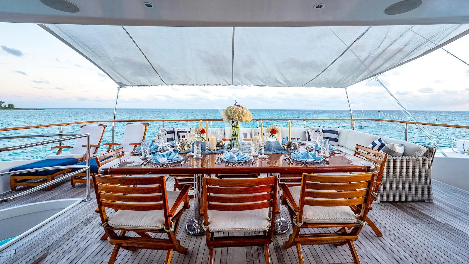 a table set for a dinner on a boat aboard PACKAGE DEAL Yacht for Charter