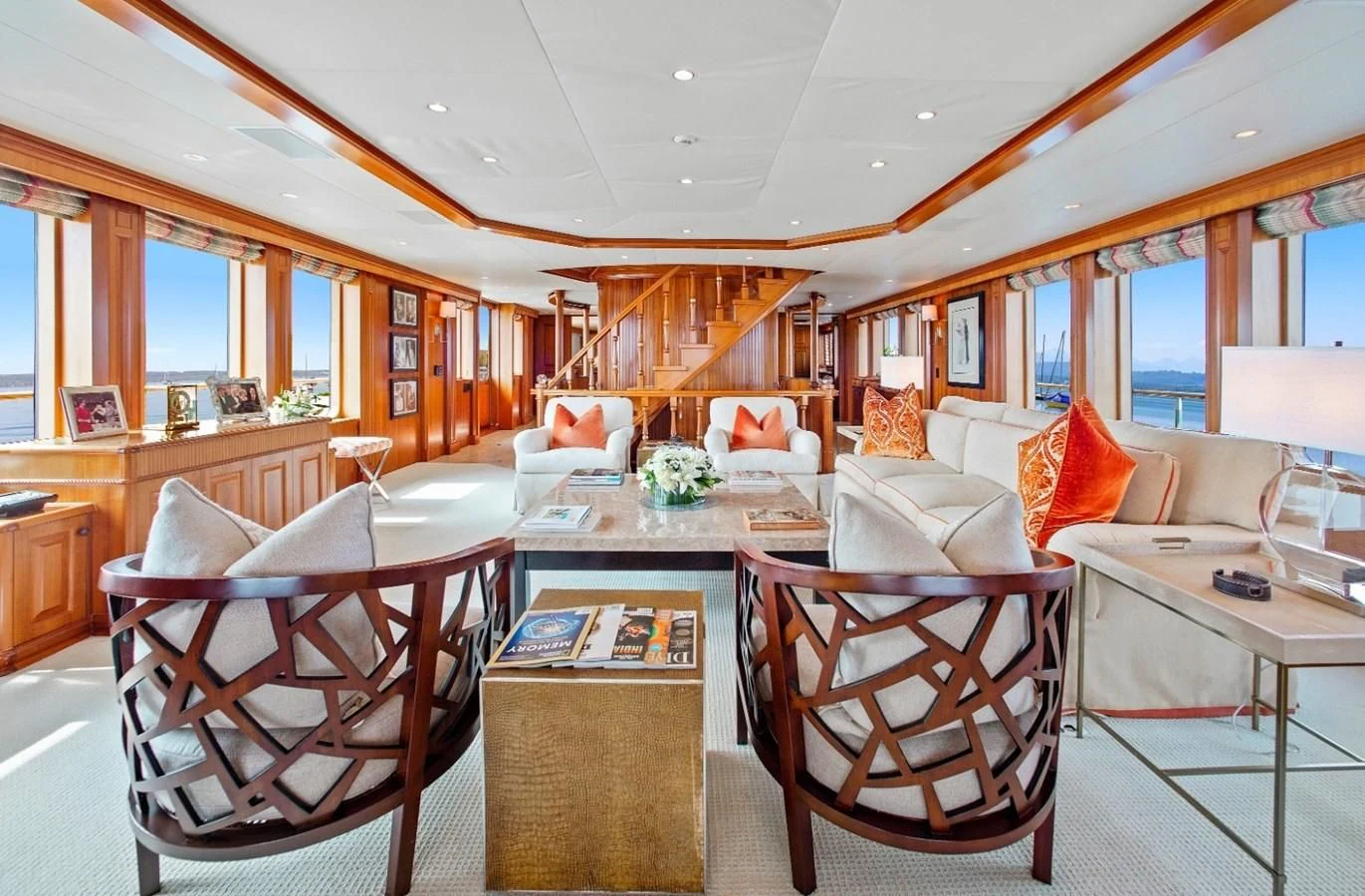 a living room with a table chairs and a window aboard PACKAGE DEAL Yacht for Charter