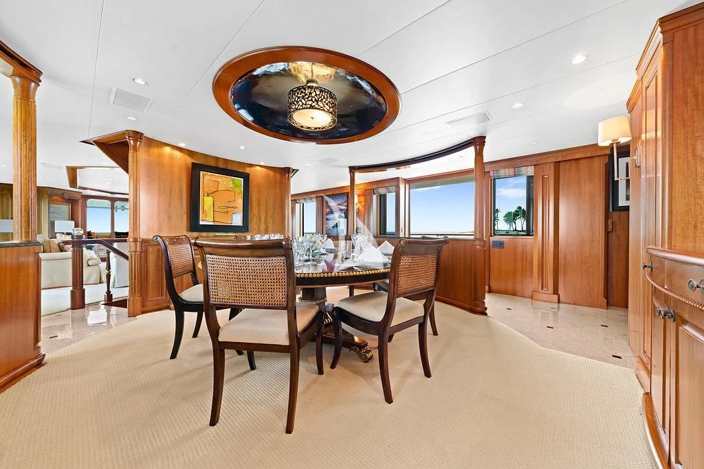 a dining room with a table and chairs aboard PACKAGE DEAL Yacht for Charter