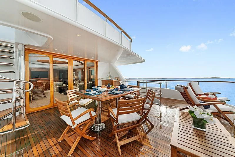 a room with a table and chairs aboard PACKAGE DEAL Yacht for Charter