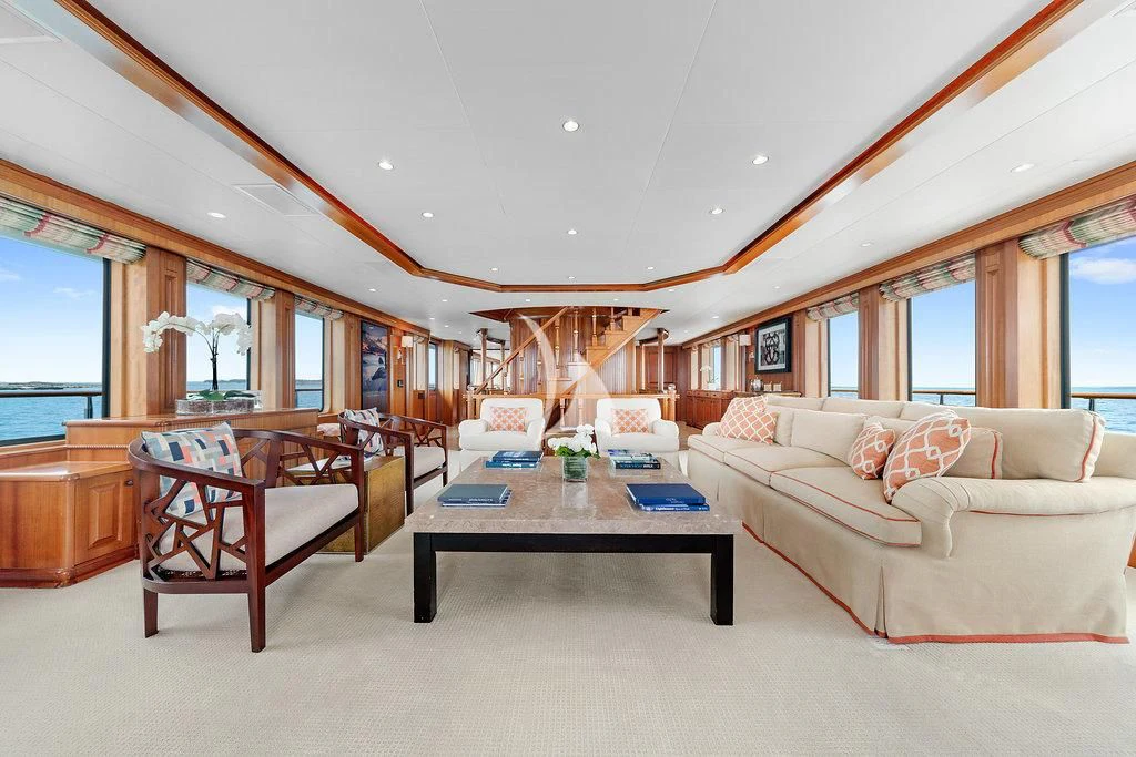 a living room with a couch and a coffee table aboard PACKAGE DEAL Yacht for Charter