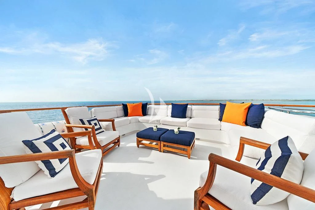 chairs and tables on a beach aboard PACKAGE DEAL Yacht for Charter