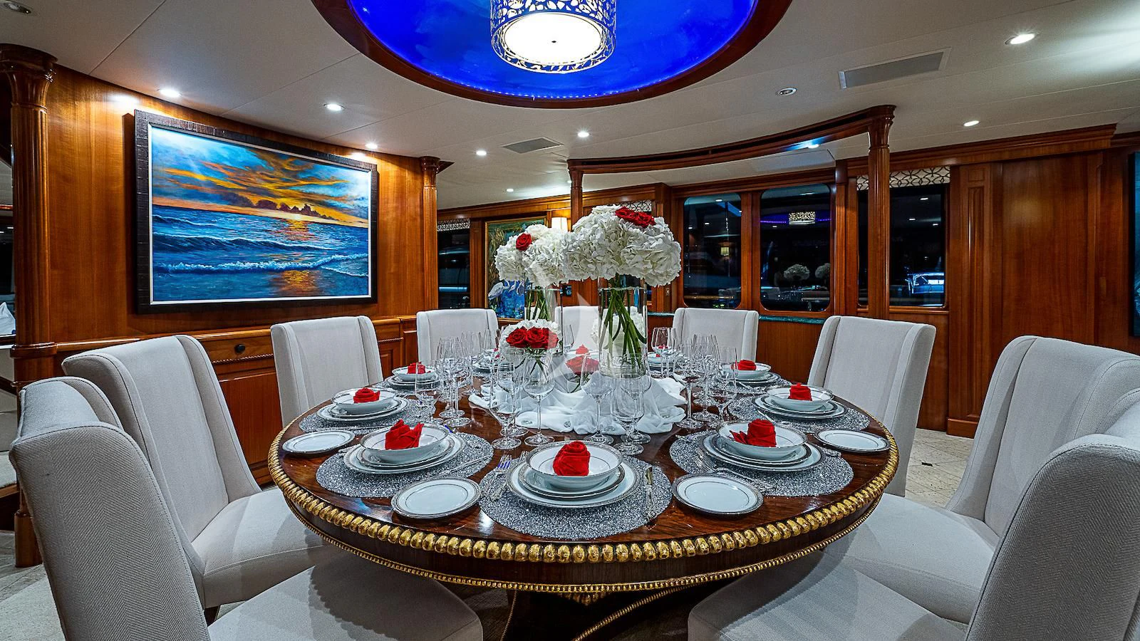 a dining room with a table set aboard PACKAGE DEAL Yacht for Charter