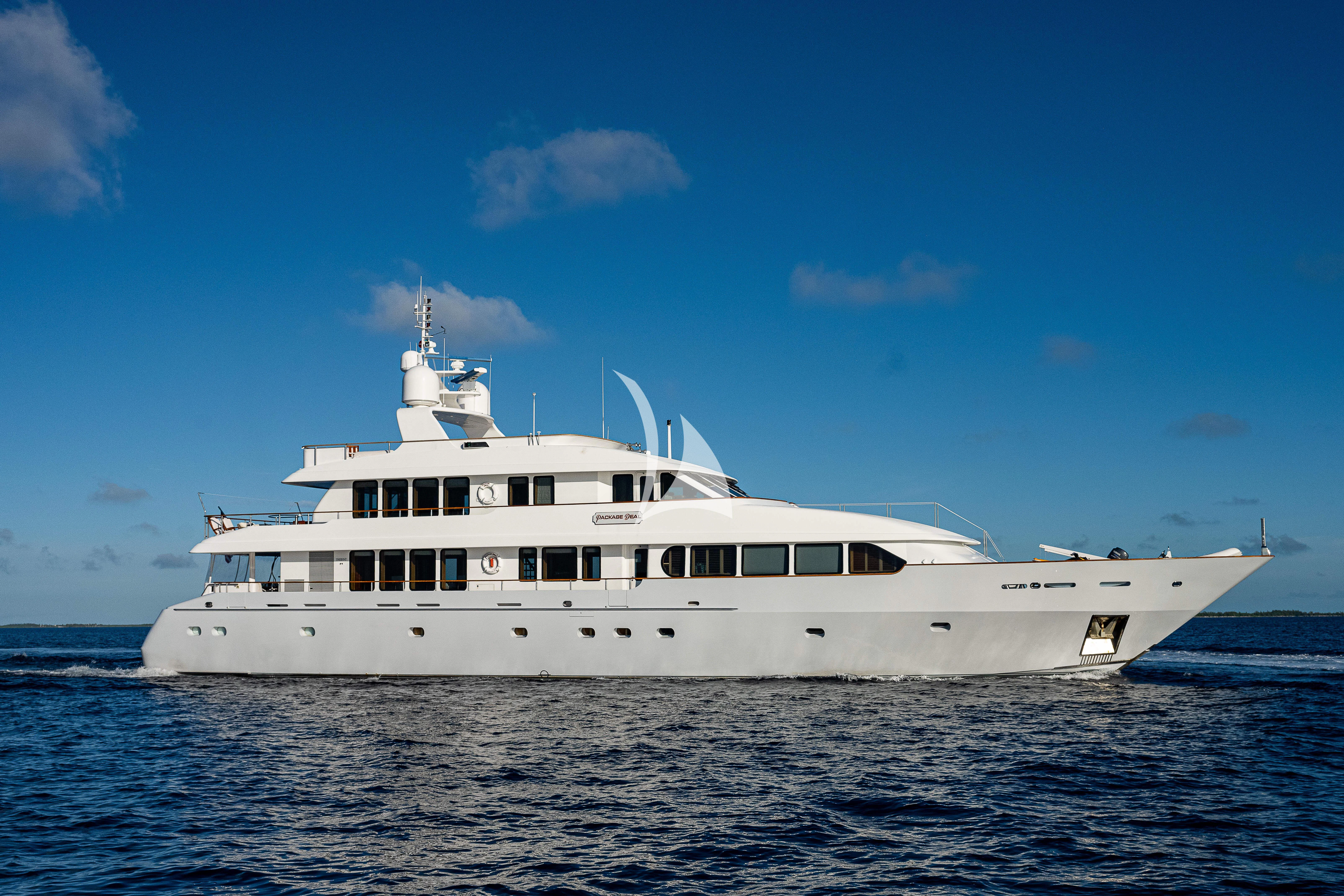 a large white boat in the water aboard PACKAGE DEAL Yacht for Charter