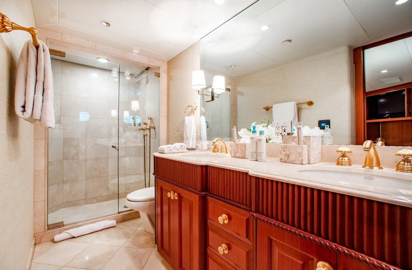 a bathroom with a glass shower aboard PACKAGE DEAL Yacht for Charter
