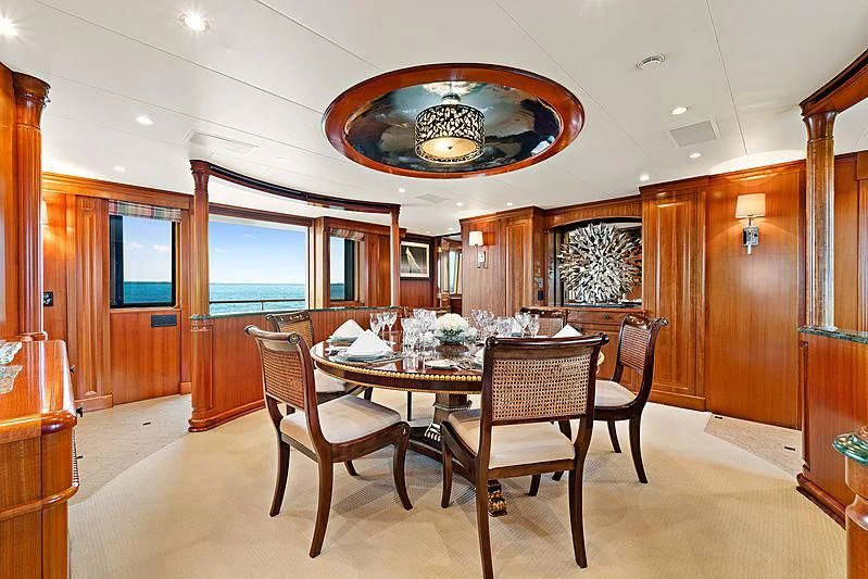 a dining room with a table and chairs aboard PACKAGE DEAL Yacht for Charter