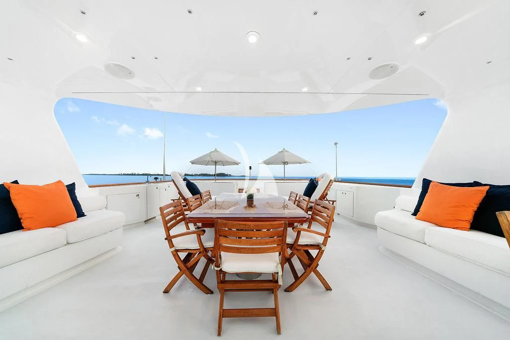 a room with a table and chairs aboard PACKAGE DEAL Yacht for Charter