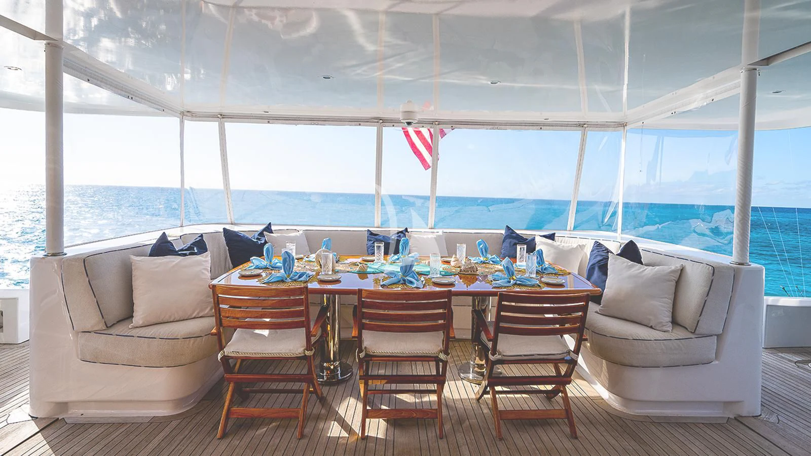 a table and chairs on a deck aboard PACKAGE DEAL Yacht for Charter