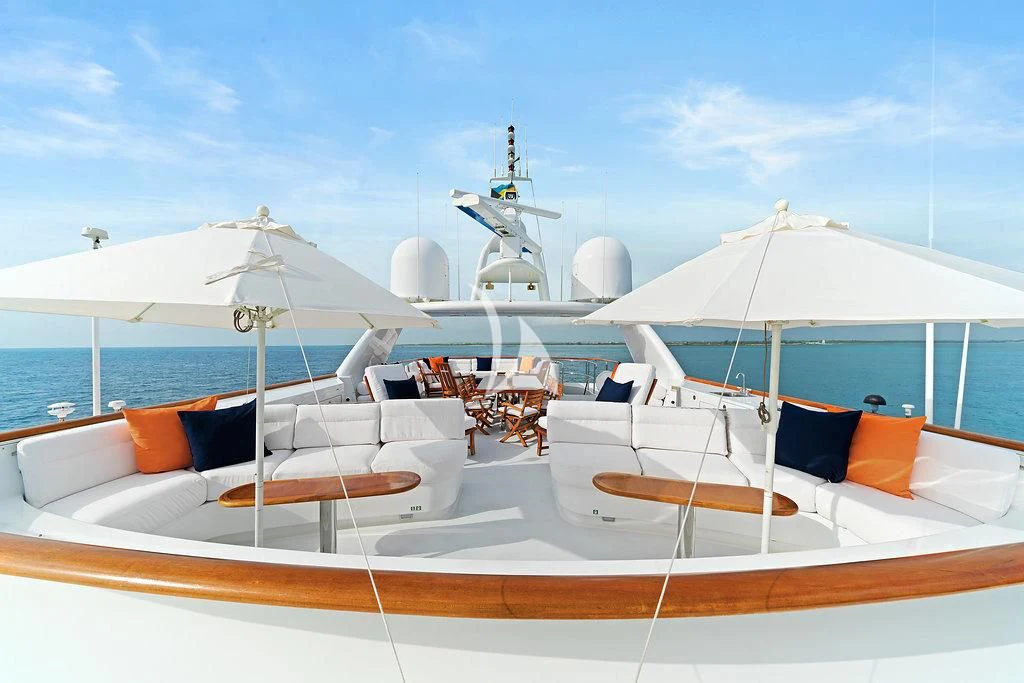 a boat with umbrellas on it aboard PACKAGE DEAL Yacht for Charter